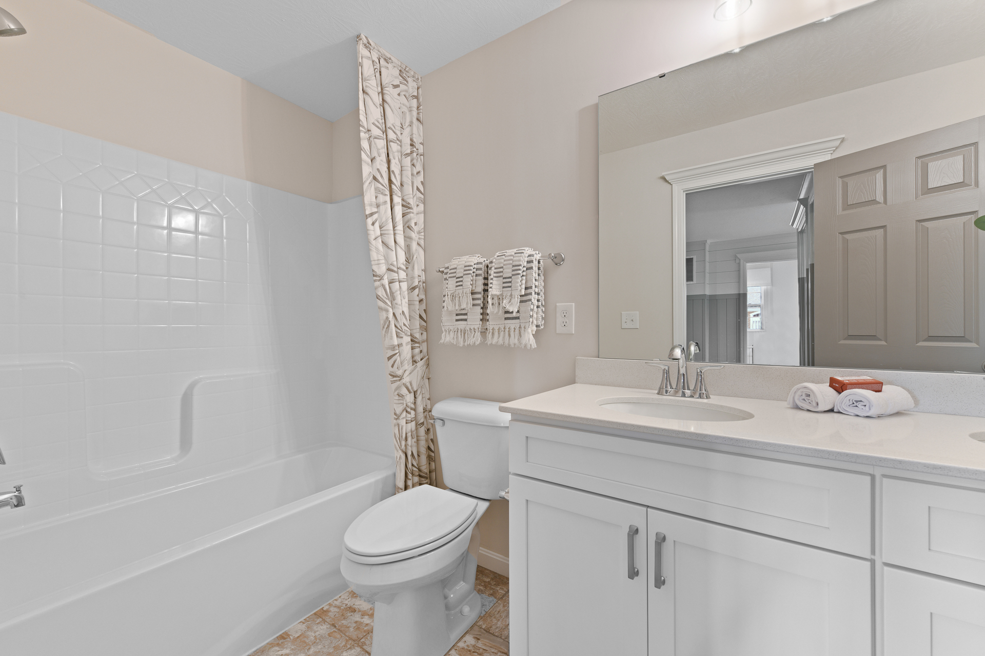 Secondary bathroom with white cabinets in Liberty Township, OH