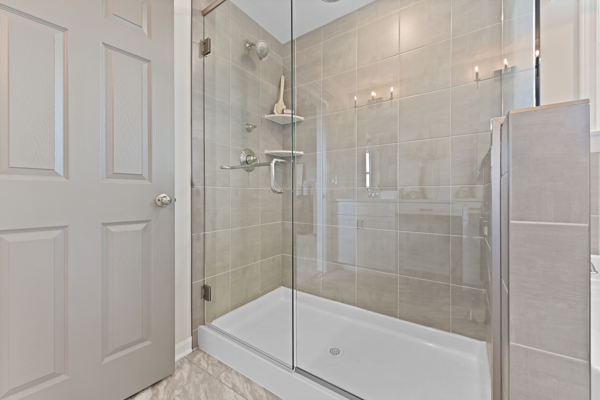 Large shower with square tiles in a new home for sale in Liberty Township, OH