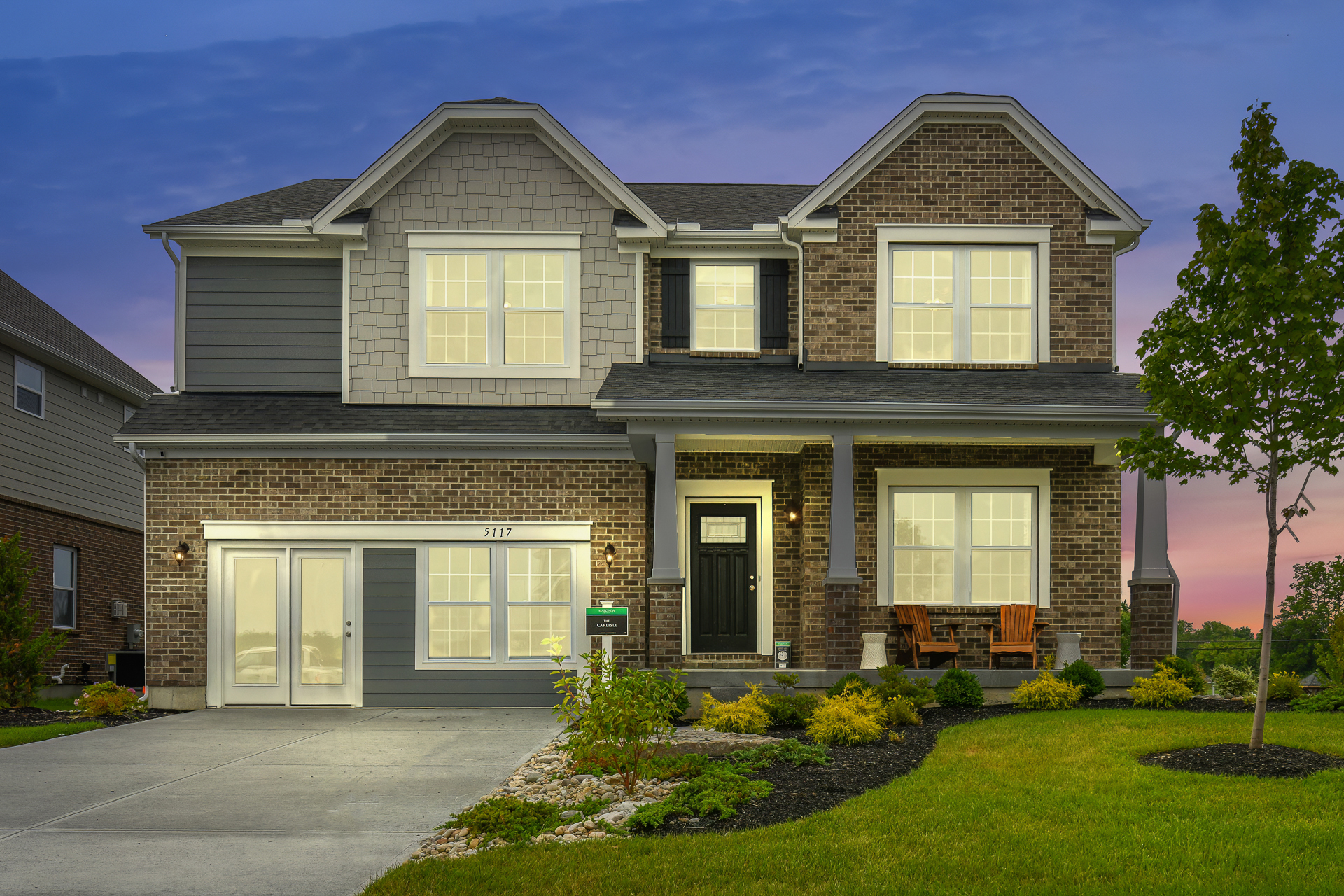 Evening view of model home for sale in in Liberty Township, OH