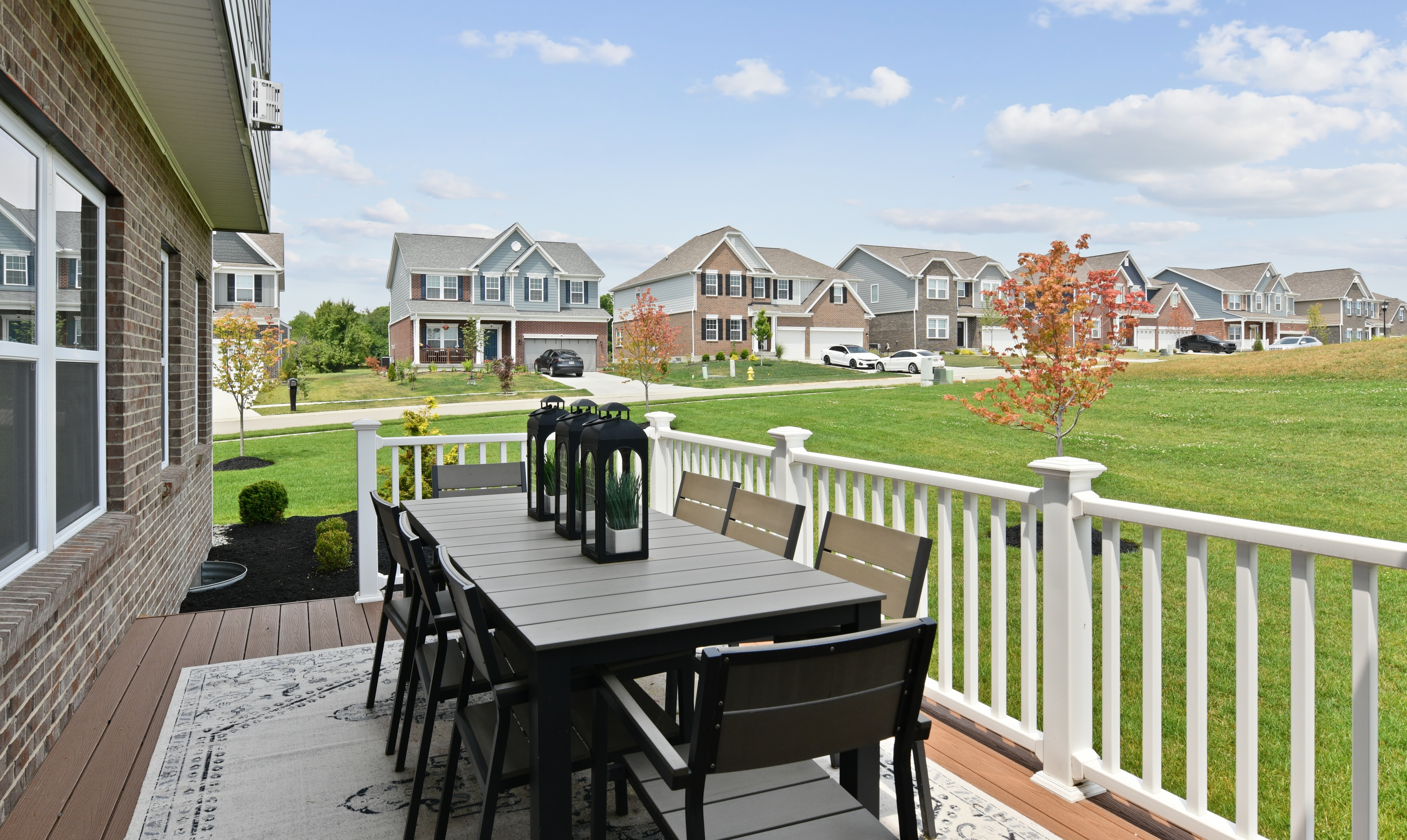 Dining area on a deck of new home in Liberty Township