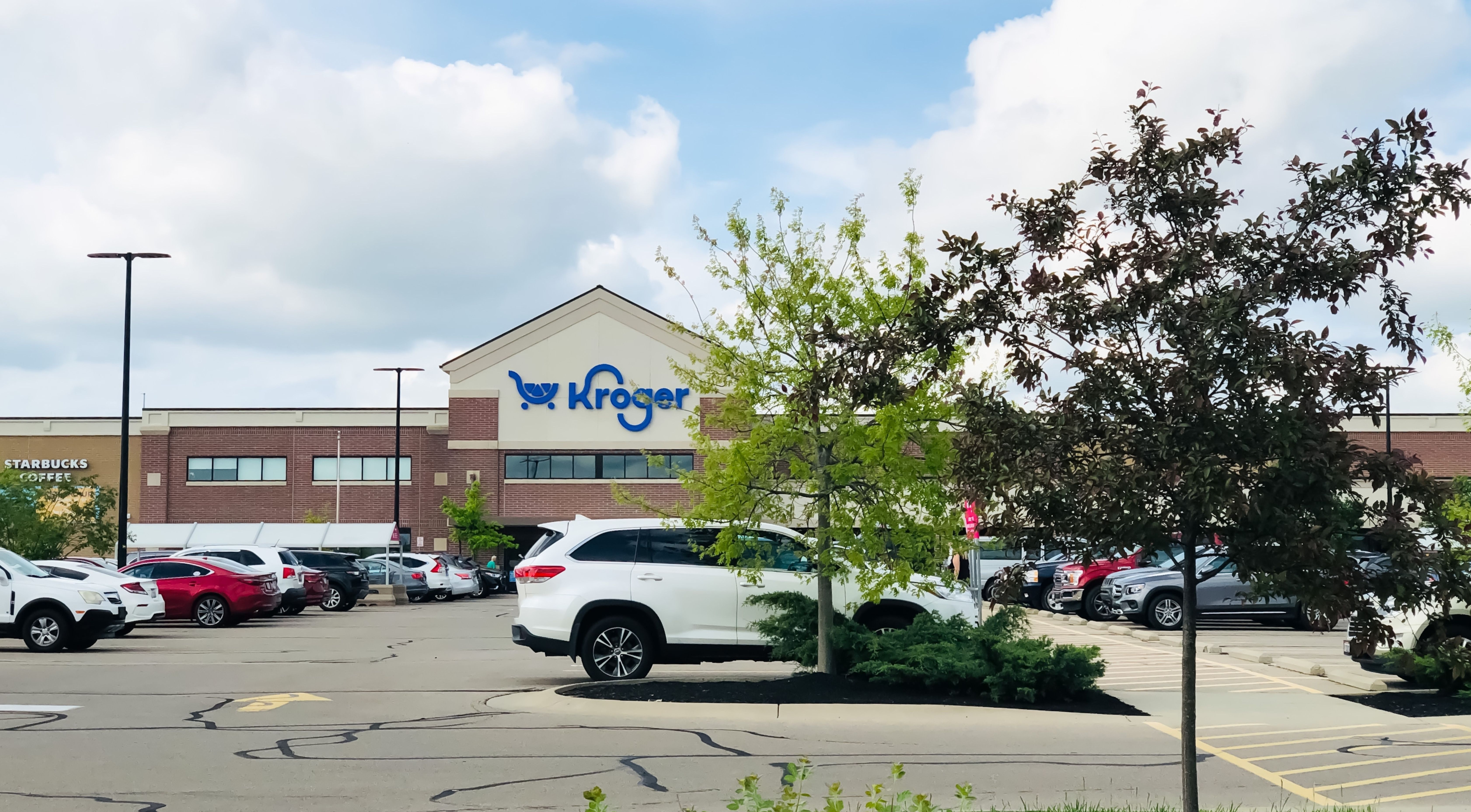Exterior and parking lot of a nearby Kroger grocery store