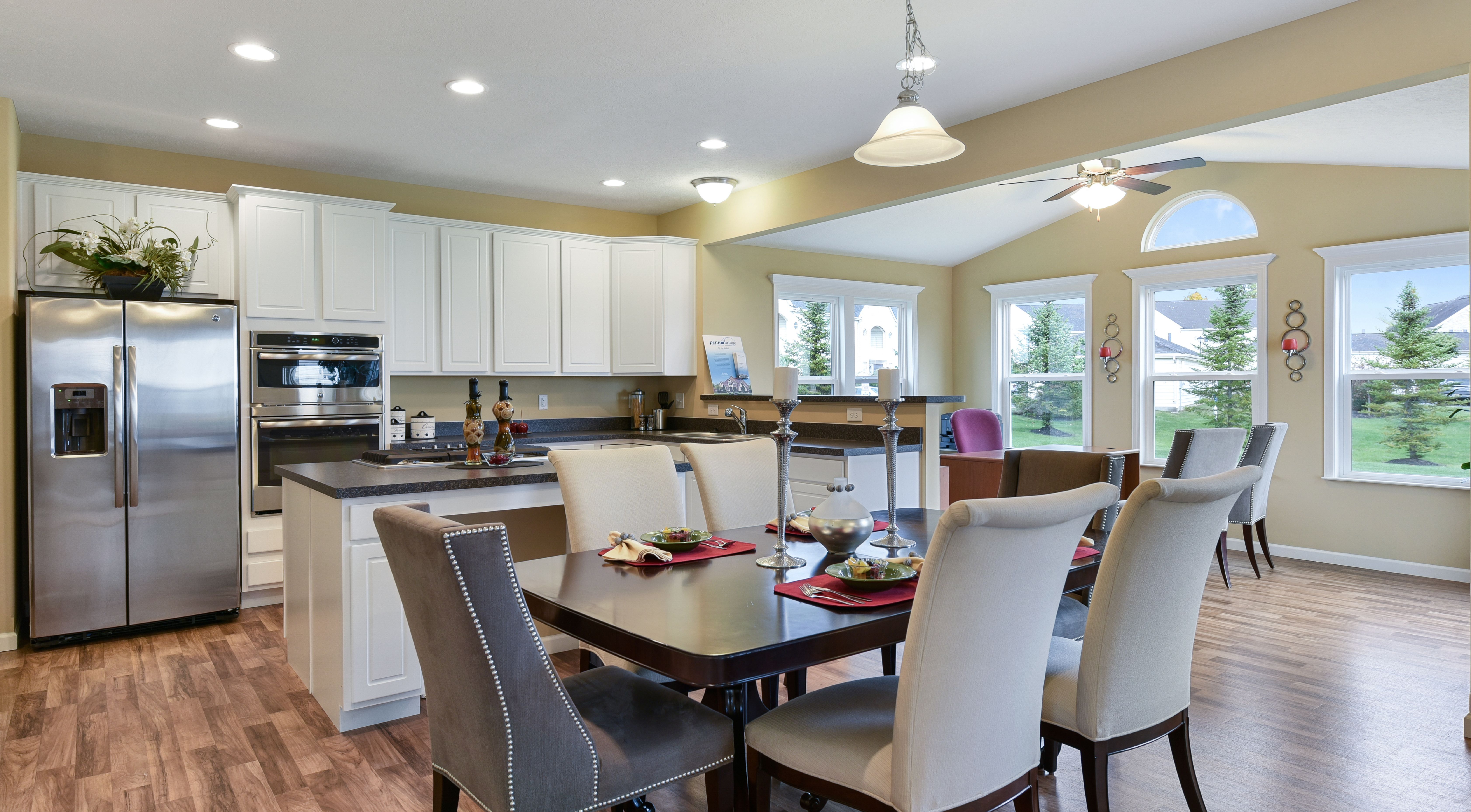 Open floor plan dining area and kitchen in a new home in Springboro