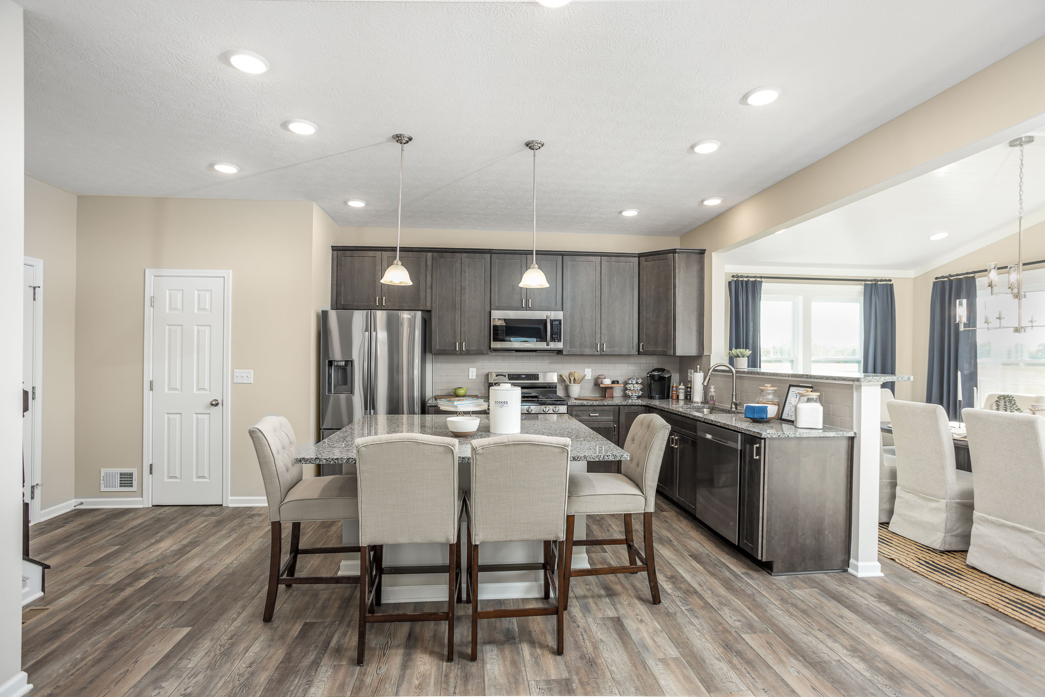 View of kitchen with island and breakfast nook in Irwin, PA