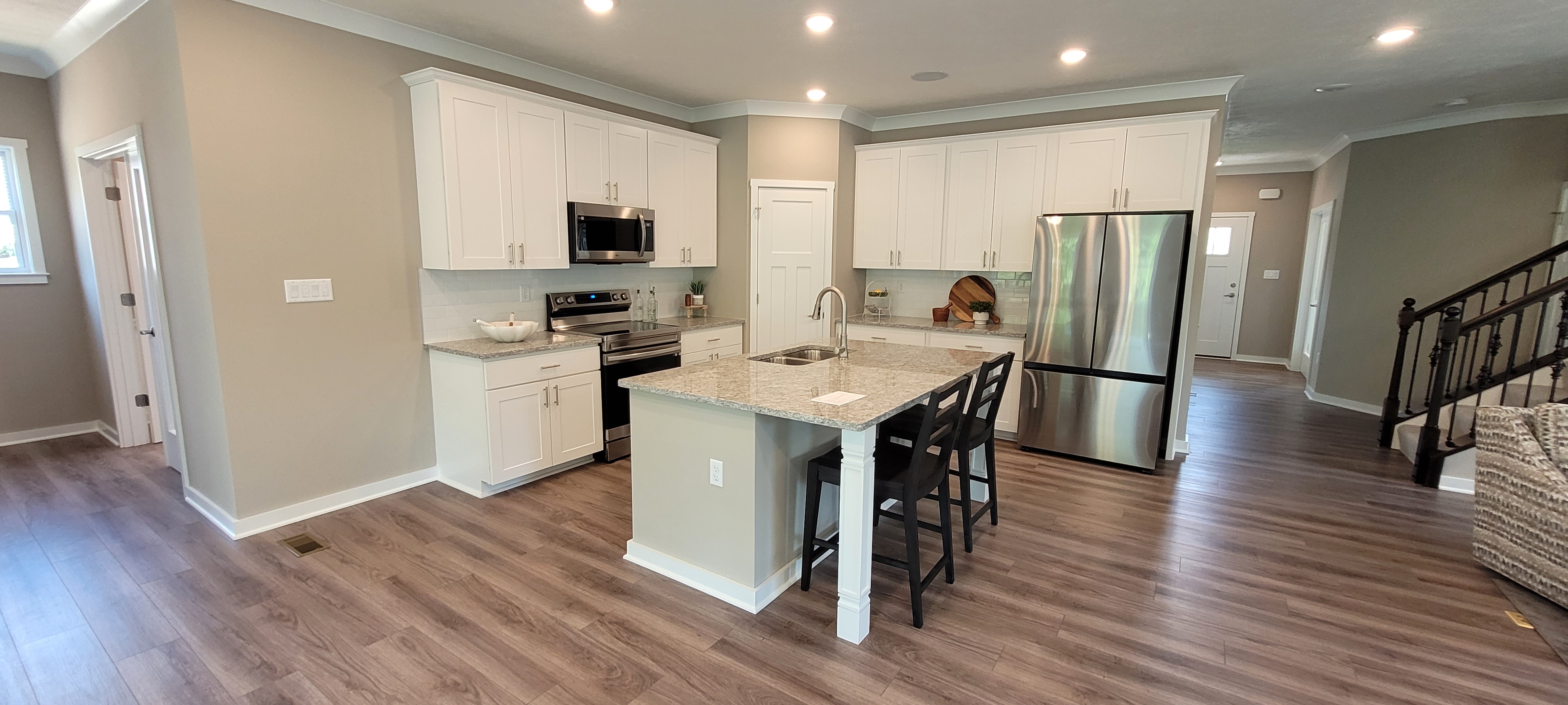 White kitchen with gray island in a new home in Imperial, PA